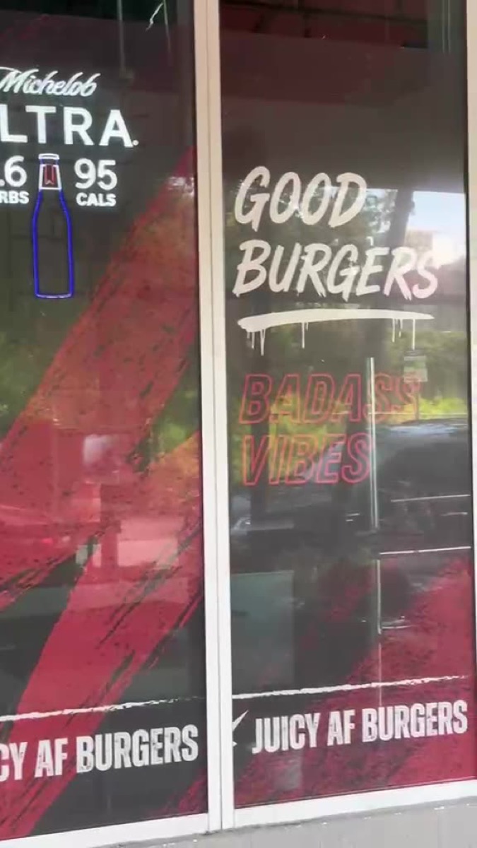 Finished window lettering and graphics at Juicy AF Burgers